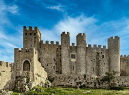 From Lisbon: Tour to Óbidos and Nazaré - Medieval Village, Ginja, and Giant Waves side 1